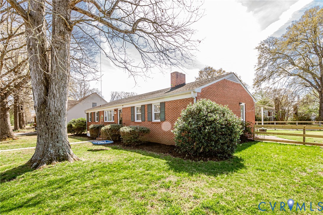 1927 F Street West Point, VA 23181 - Photo 49 of 59 a front view of a house with a yard and trees
