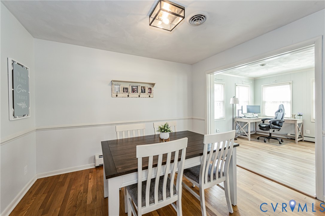 1927 F Street West Point, VA 23181 - Photo 10 of 59 a view of a dining room with furniture and a chandelier