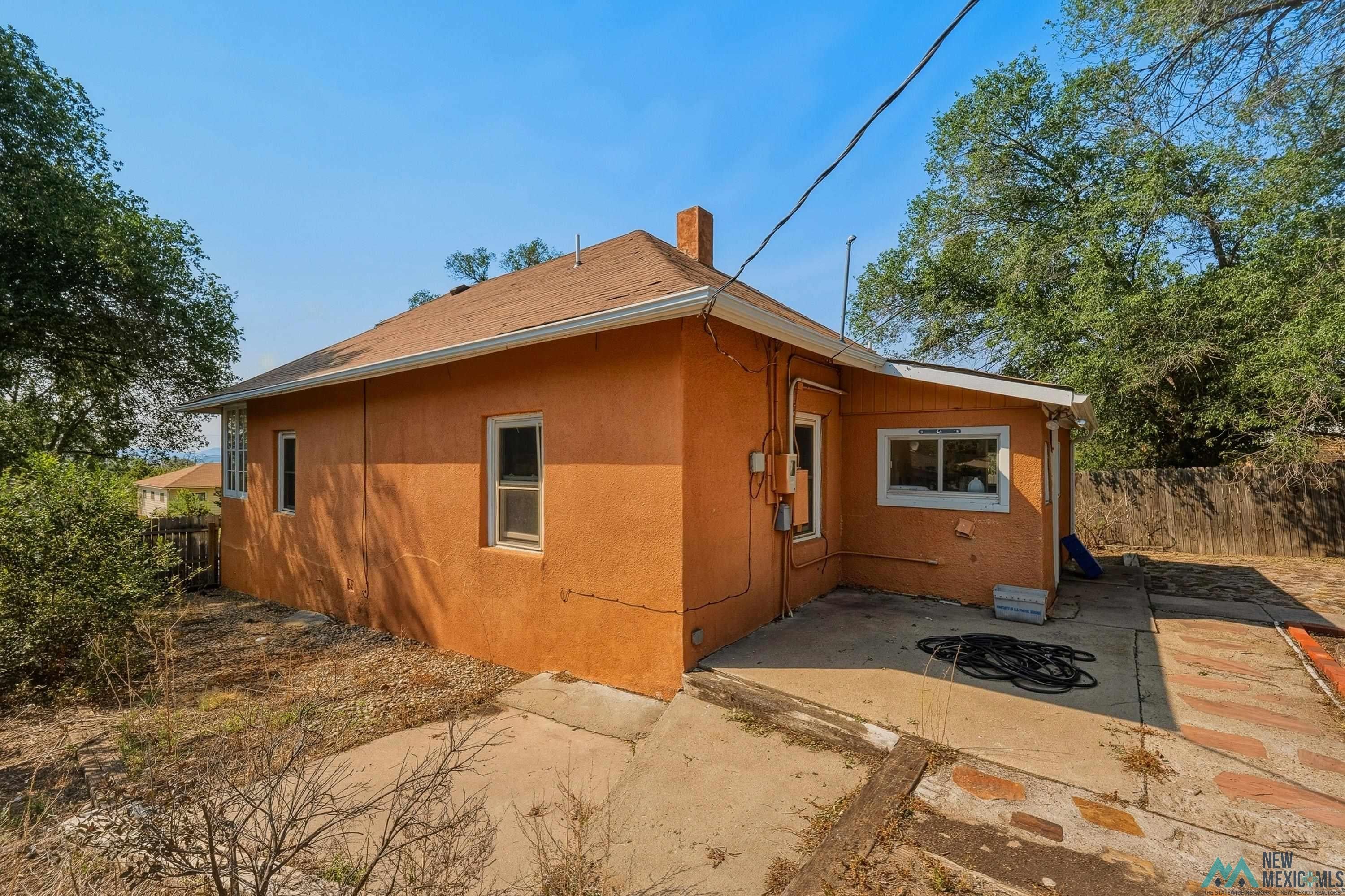 1026 South 5th Street Raton, NM 87740 - Photo 27 of 33 Stucco exterior with a pitched shingle roof