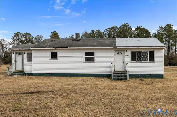 a house with trees in the background