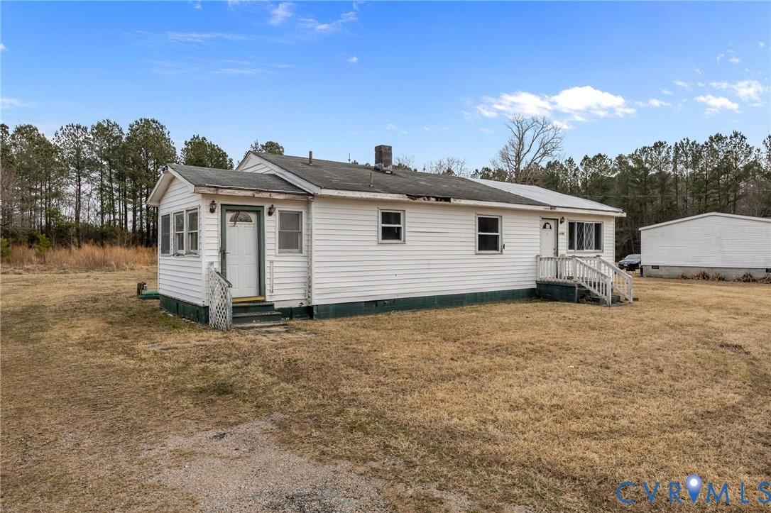 10187 Birch Island Road Wakefield, VA 23888 - Photo 11 of 41 a view of a house with a backyard