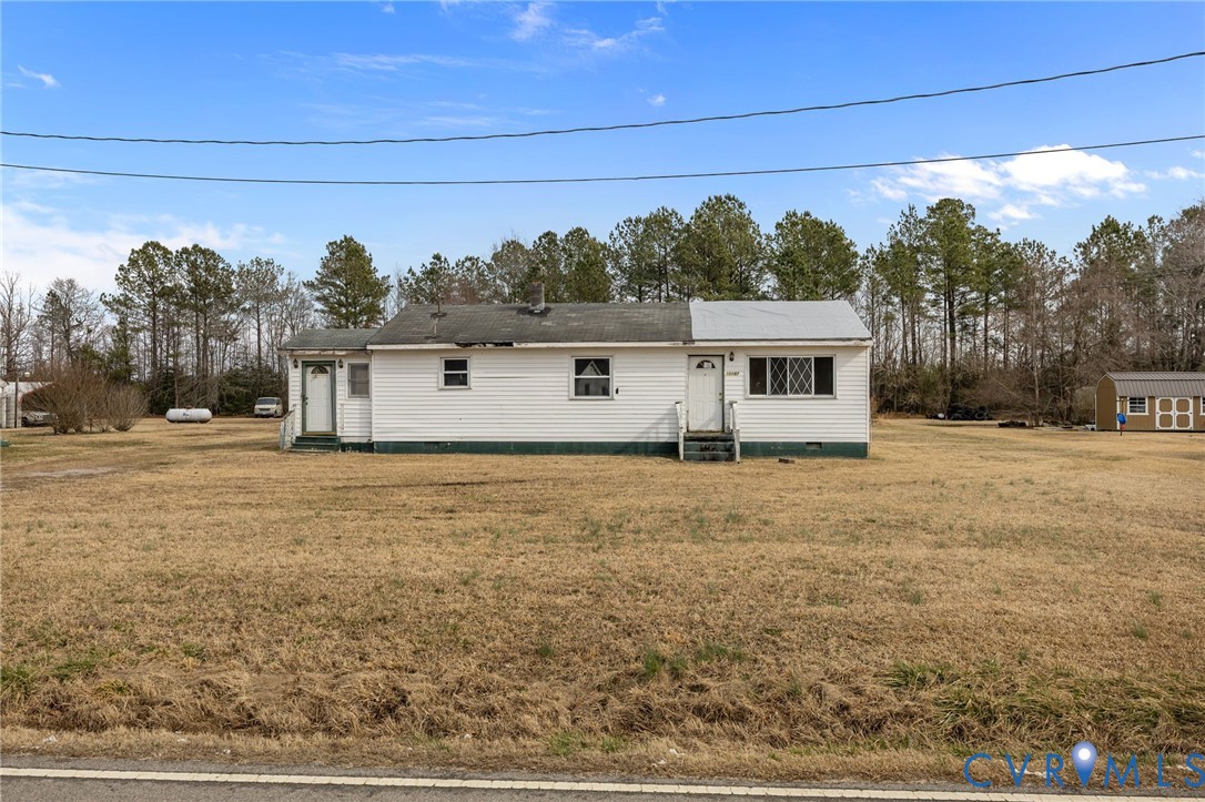 10187 Birch Island Road Wakefield, VA 23888 - Photo 12 of 41 a front view of a house with a yard