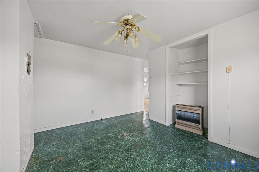 10187 Birch Island Road Wakefield, VA 23888 - Photo 29 of 41 a view of room with staircase and a ceiling fan