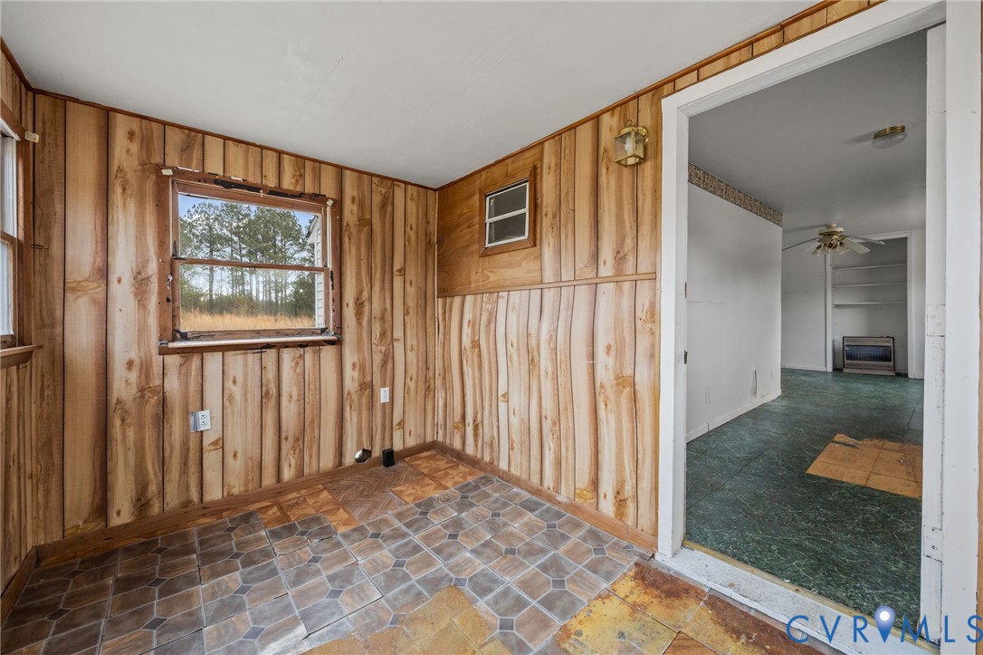 10187 Birch Island Road Wakefield, VA 23888 - Photo 40 of 41 a view of a hallway with wooden floor and a livingroom