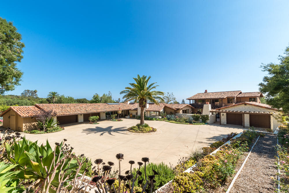 a view of swimming pool with outdoor seating and plants
