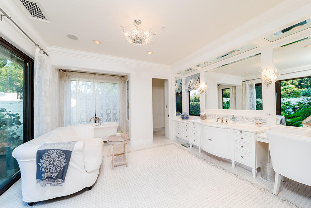 881 San Ysidro Lane Montecito, CA 93108 - Photo 17 of 78 a large white kitchen with a large window