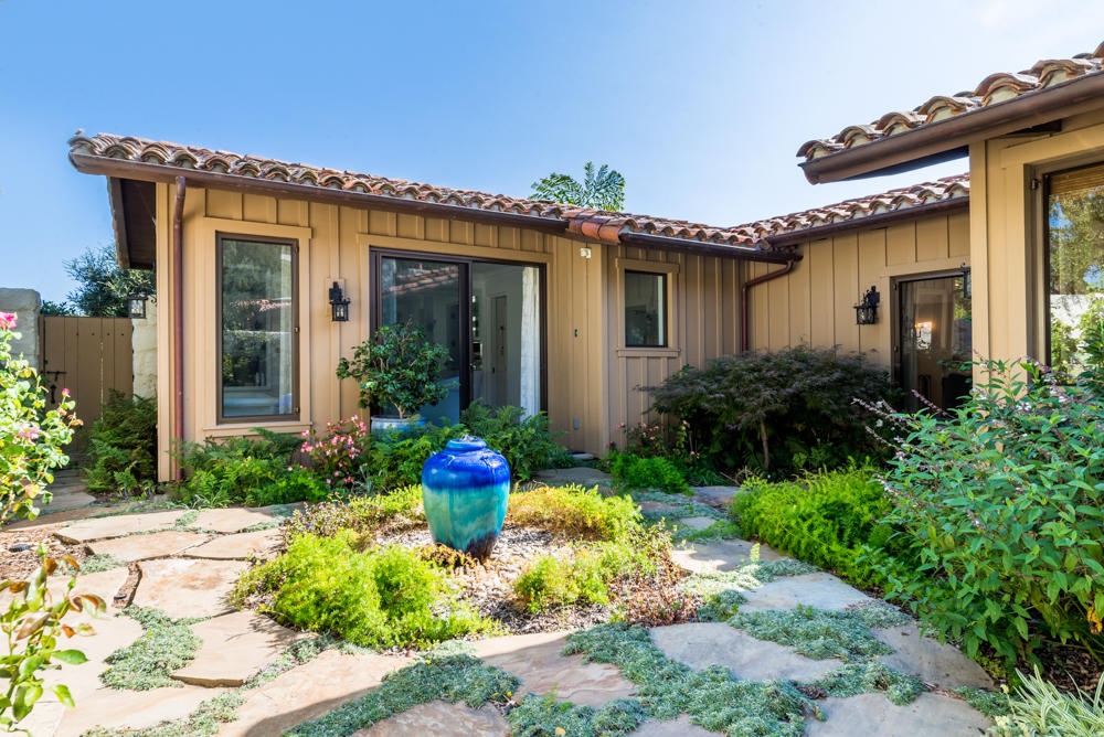 881 San Ysidro Lane Montecito, CA 93108 - Photo 22 of 78 a front view of a house with garden