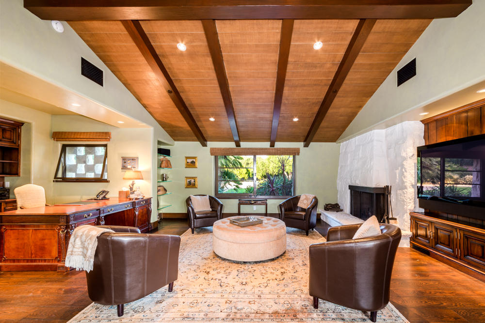 881 San Ysidro Lane Montecito, CA 93108 - Photo 23 of 78 a living room with fireplace furniture and a flat screen tv