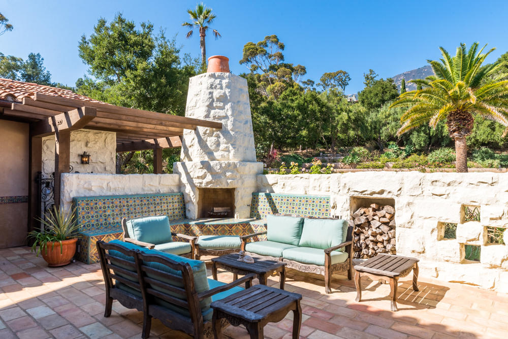 881 San Ysidro Lane Montecito, CA 93108 - Photo 27 of 78 a view of a patio with couple of chairs and a fountain