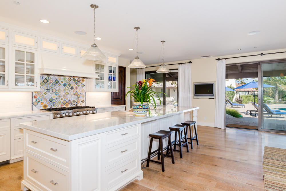 881 San Ysidro Lane Montecito, CA 93108 - Photo 31 of 78 a kitchen with stainless steel appliances kitchen island granite countertop a stove a sink and a refrigerator