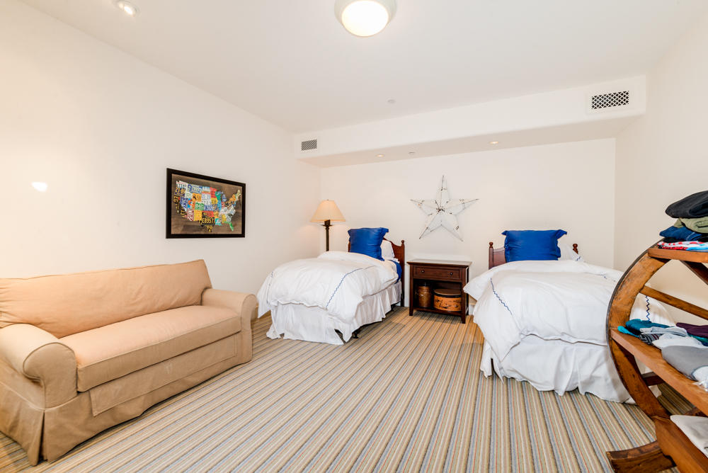 881 San Ysidro Lane Montecito, CA 93108 - Photo 41 of 78 a bedroom with two beds and painting on the wall