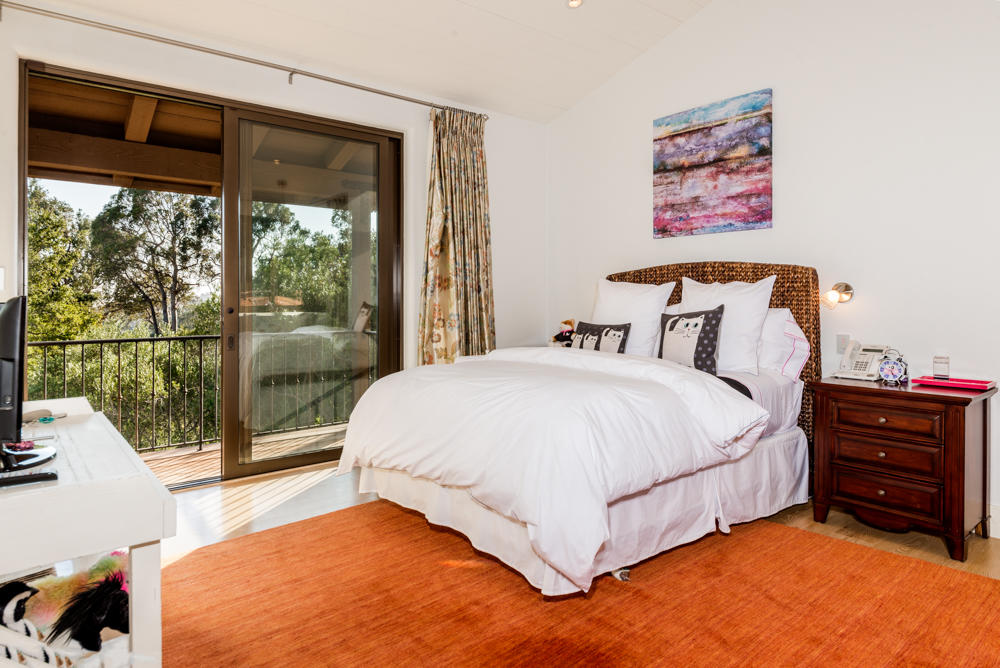 881 San Ysidro Lane Montecito, CA 93108 - Photo 46 of 78 a spacious bedroom with a bed and a large window
