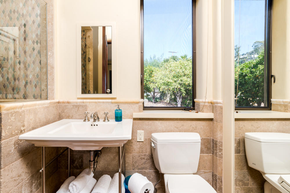 881 San Ysidro Lane Montecito, CA 93108 - Photo 54 of 78 a bathroom with a sink and a toilet