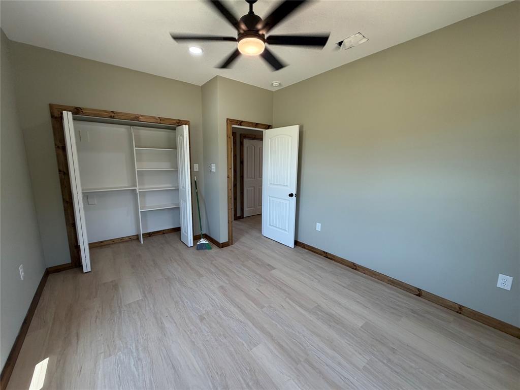 1040 Rays Way Weatherford, TX 76085 - Photo 19 of 23 Bedroom featuring light wood-finish flooring and neutral wall tones