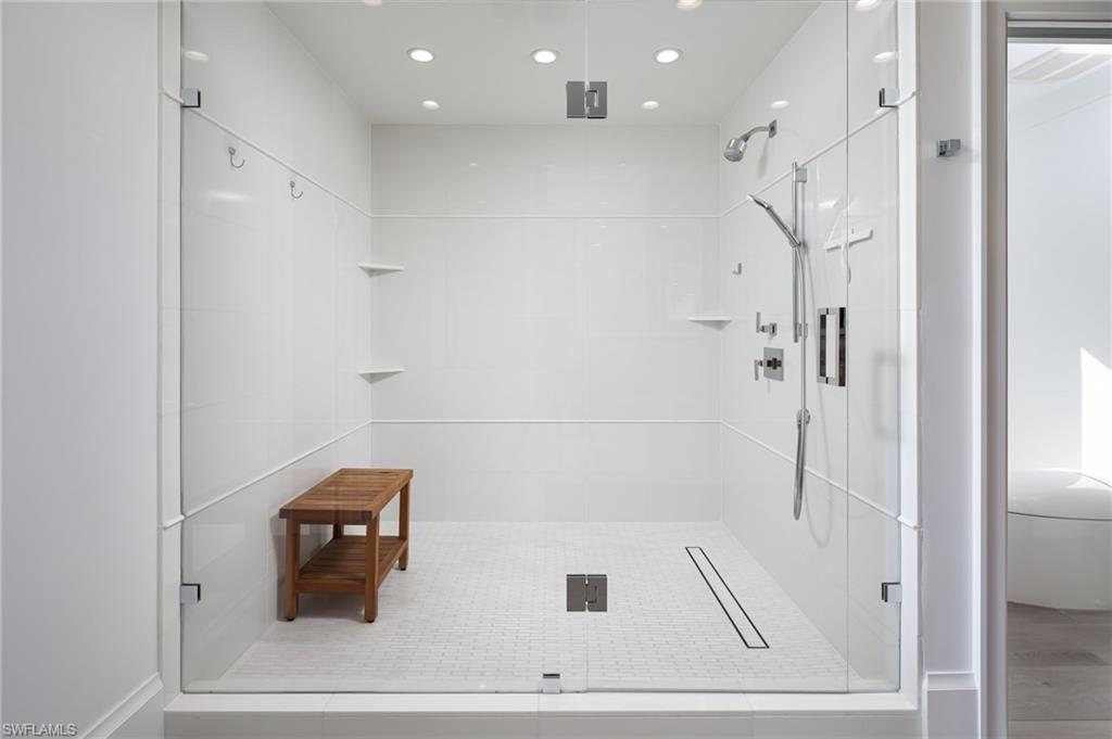 512 Neapolitan Lane Naples, FL 34103 - Photo 18 of 35 a bathroom with a shower