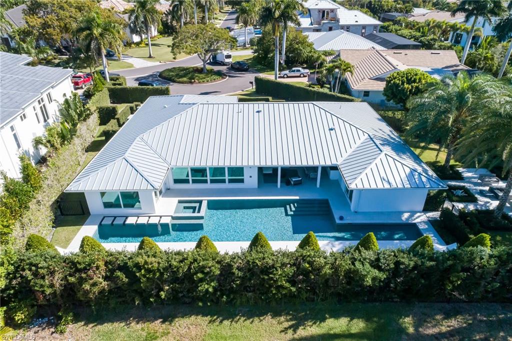 512 Neapolitan Lane Naples, FL 34103 - Photo 30 of 35 an aerial view of a house with swimming pool garden and outdoor seating