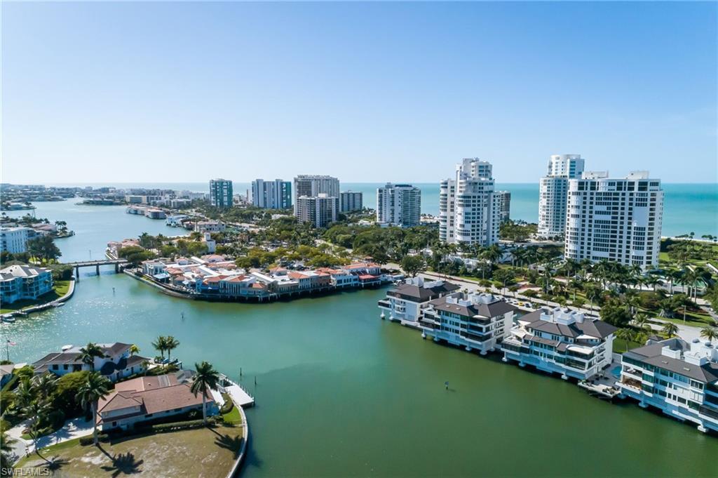 512 Neapolitan Lane Naples, FL 34103 - Photo 34 of 35 an aerial view of a city with a lake