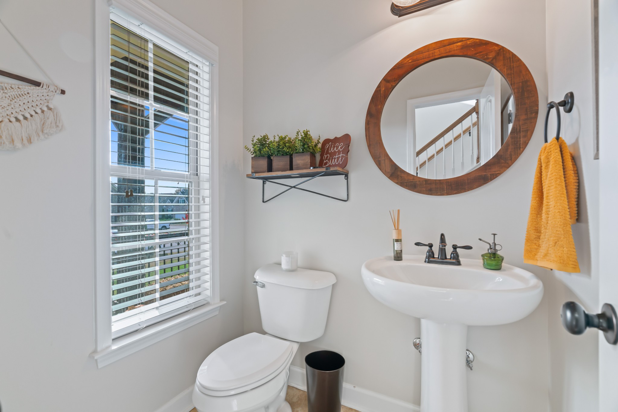 1003 Claymill Drive Spring Hill, TN 37174 - Photo 15 of 62 a bathroom with a toilet a sink and a mirror