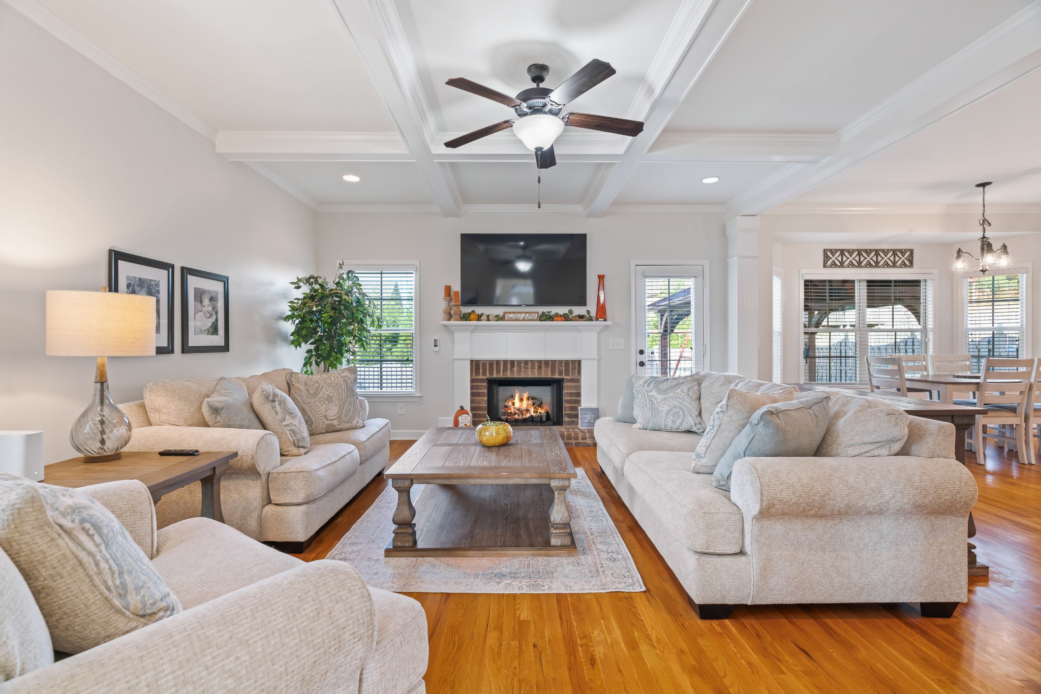 1003 Claymill Drive Spring Hill, TN 37174 - Photo 16 of 62 a living room with furniture a flat screen tv and a fireplace