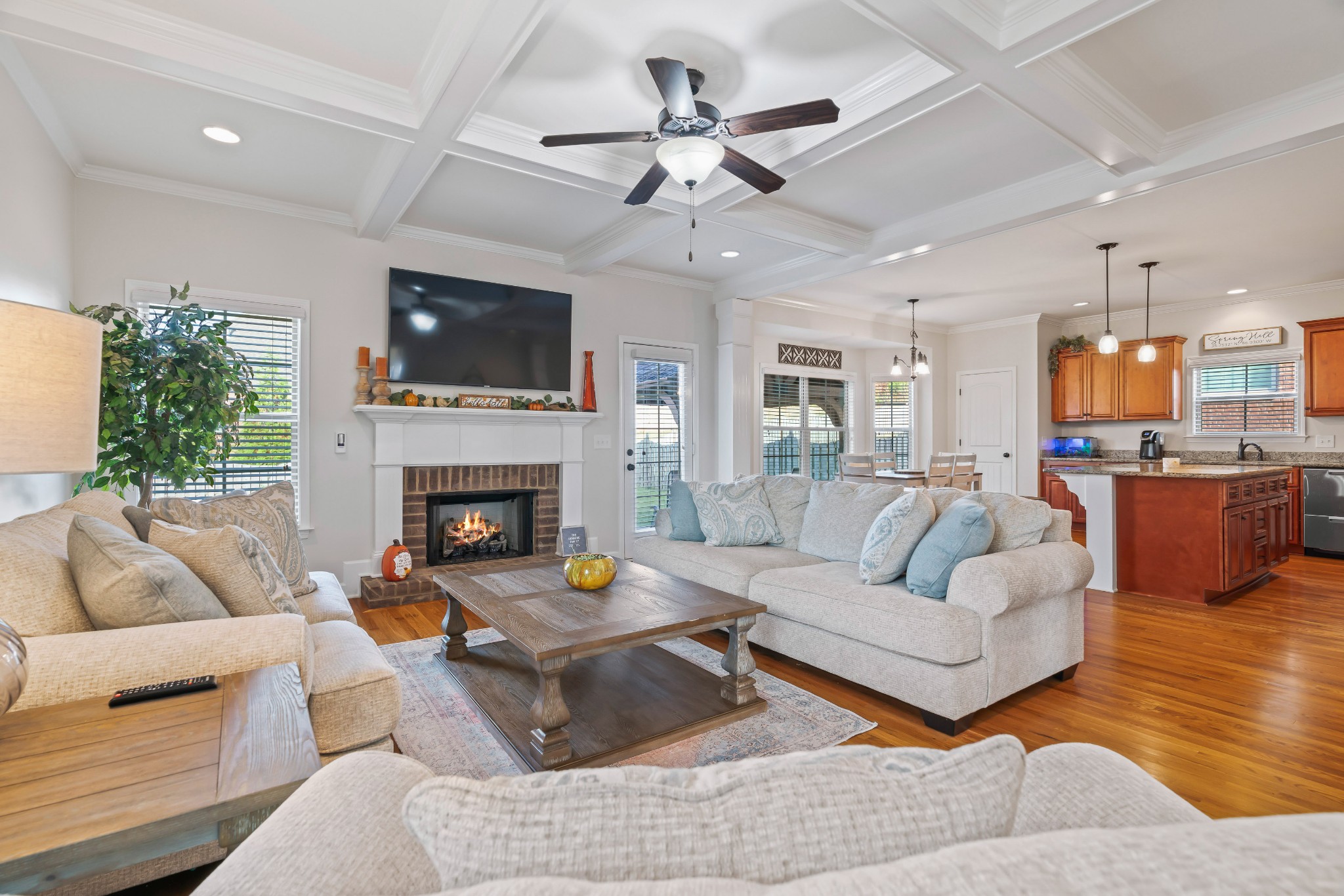 1003 Claymill Drive Spring Hill, TN 37174 - Photo 17 of 62 a living room with furniture kitchen view and a fireplace