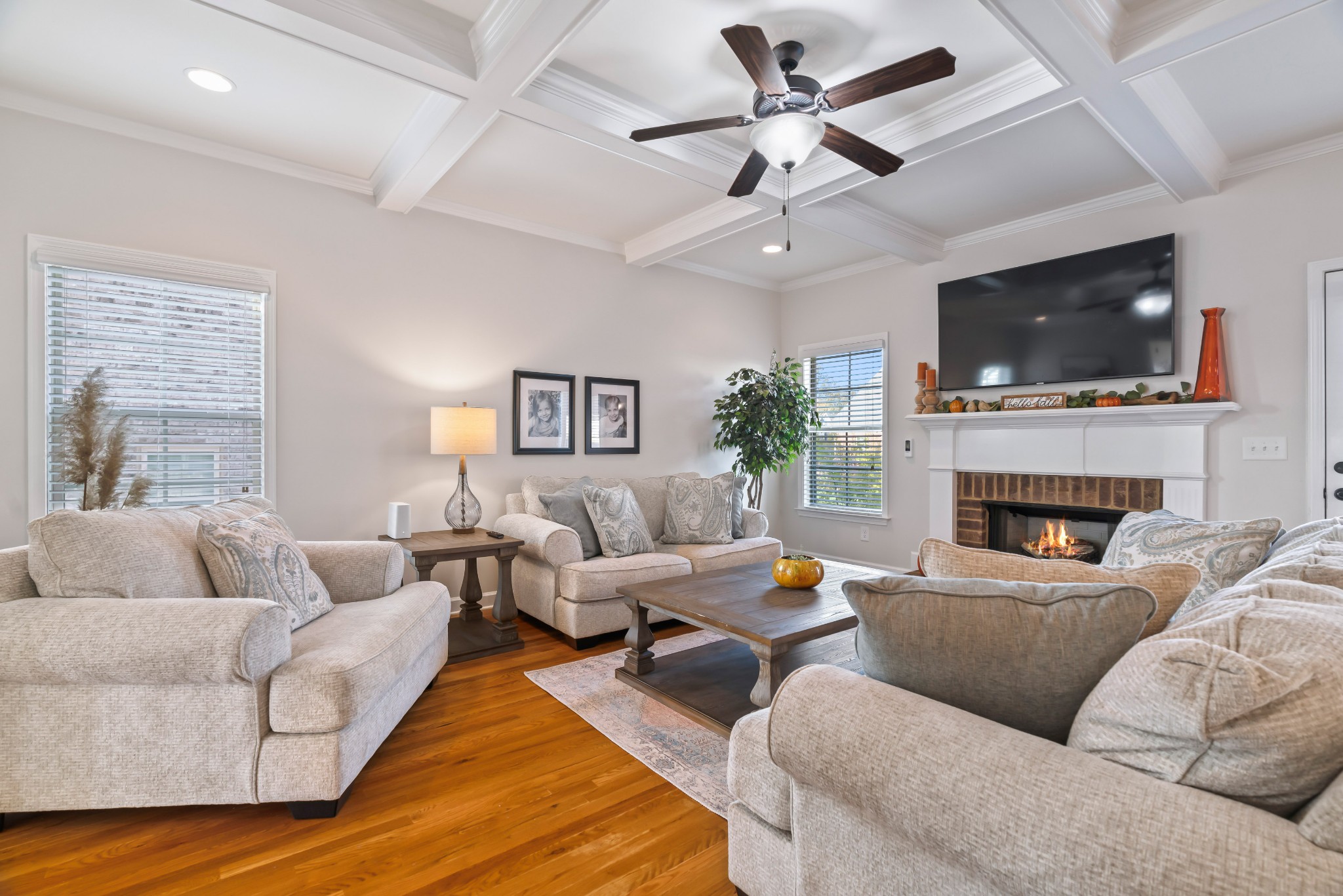 1003 Claymill Drive Spring Hill, TN 37174 - Photo 18 of 62 a living room with furniture a flat screen tv and a fireplace