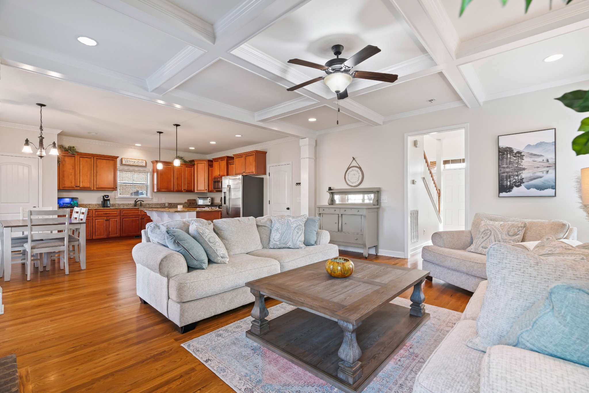 1003 Claymill Drive Spring Hill, TN 37174 - Photo 20 of 62 a living room with furniture kitchen view and a chandelier