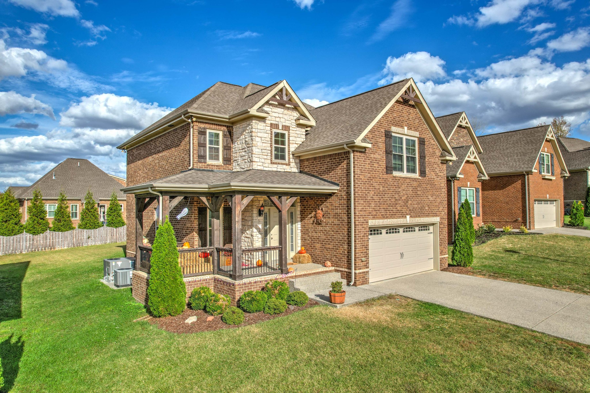 1003 Claymill Drive Spring Hill, TN 37174 - Photo 2 of 62 a front view of a house with a yard