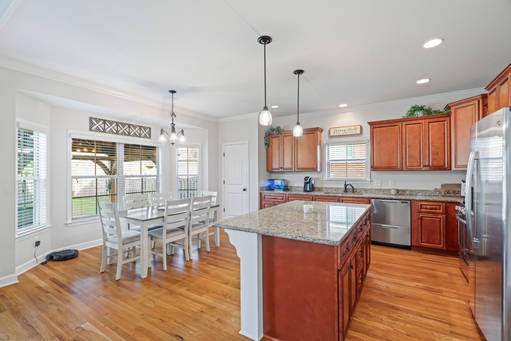 1003 Claymill Drive Spring Hill, TN 37174 - Photo 22 of 62 a kitchen with stainless steel appliances granite countertop sink stove top oven and cabinets