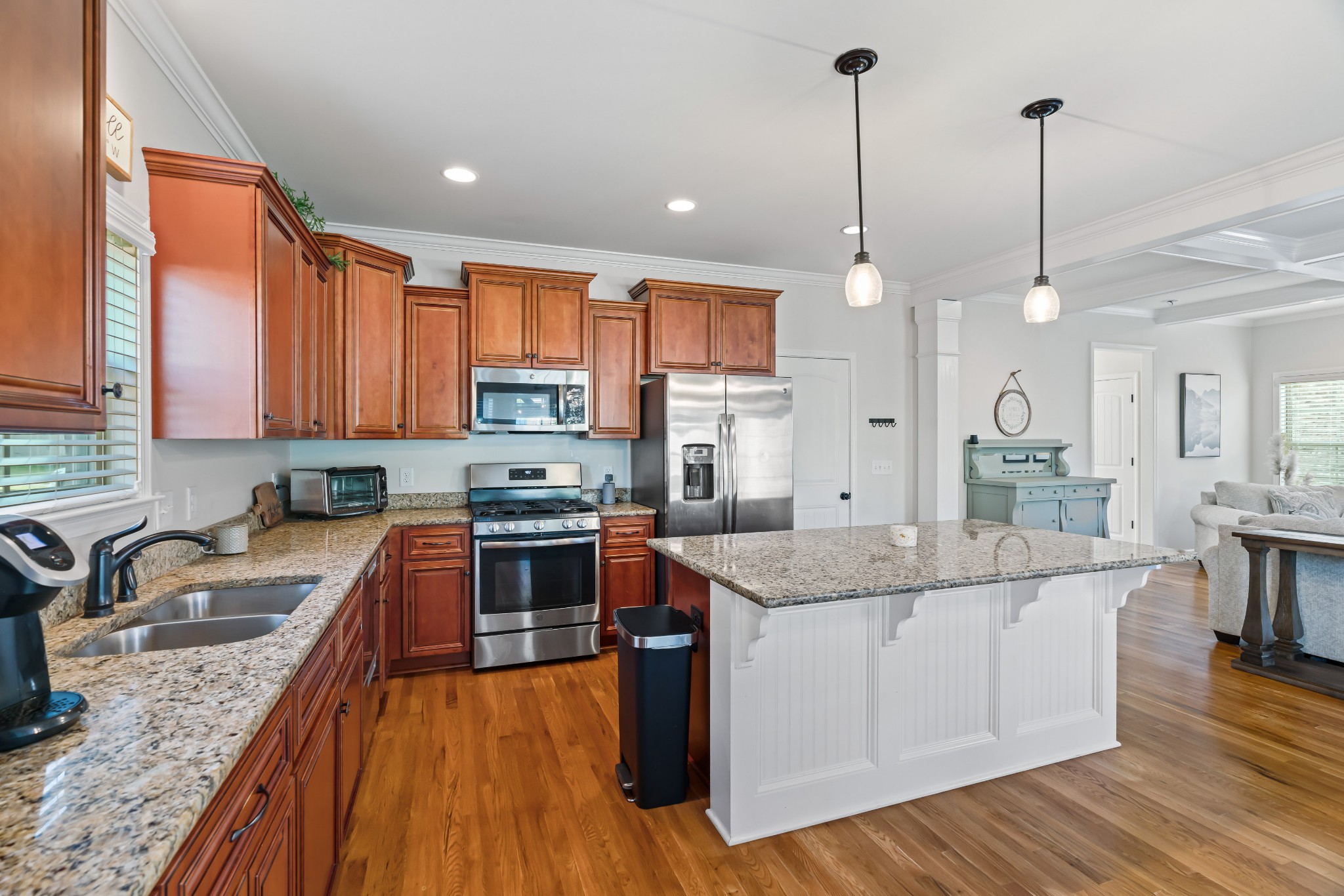 1003 Claymill Drive Spring Hill, TN 37174 - Photo 24 of 62 a kitchen with stainless steel appliances granite countertop a sink a stove and a wooden floors