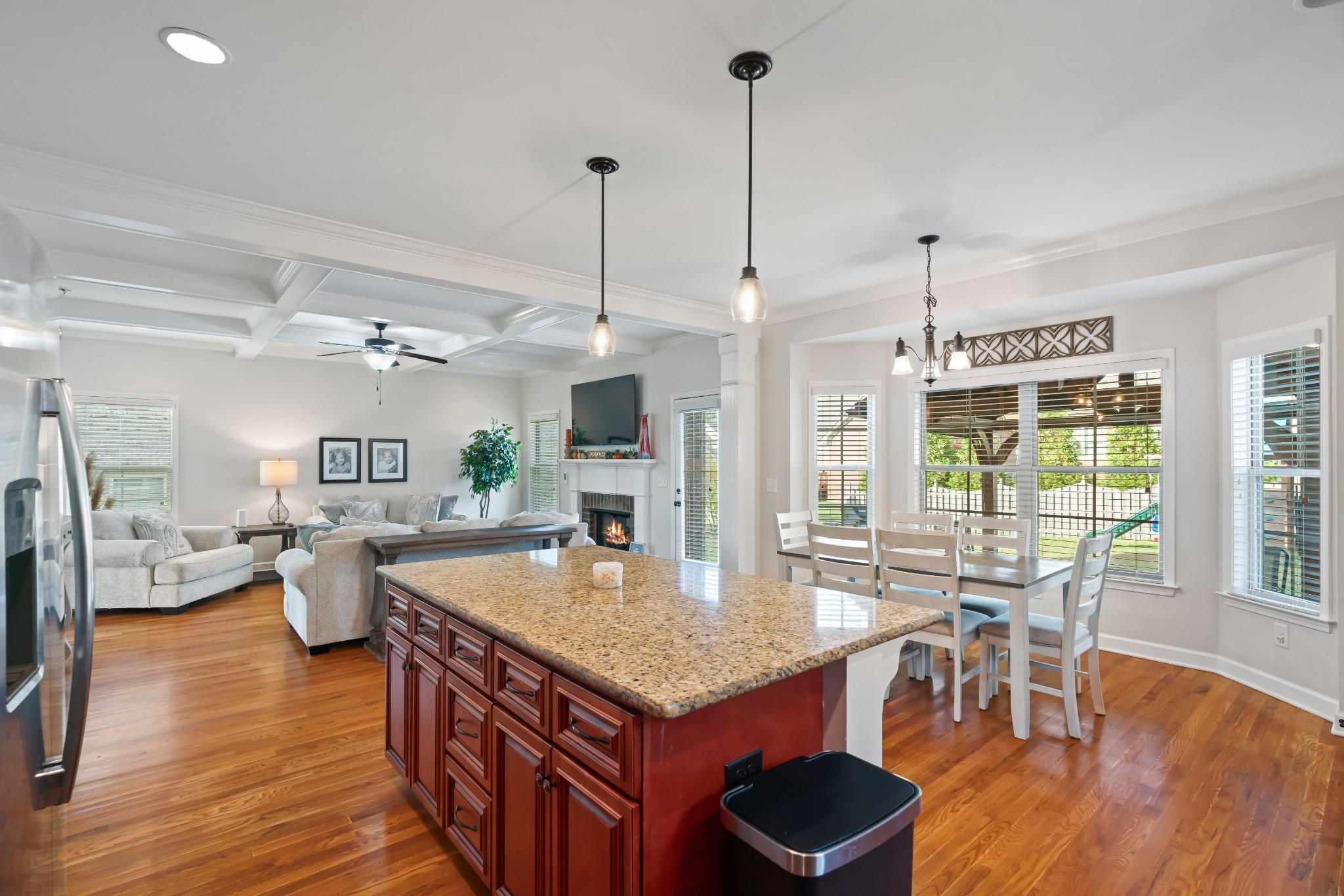 1003 Claymill Drive Spring Hill, TN 37174 - Photo 26 of 62 a kitchen with a table chairs and wooden floor