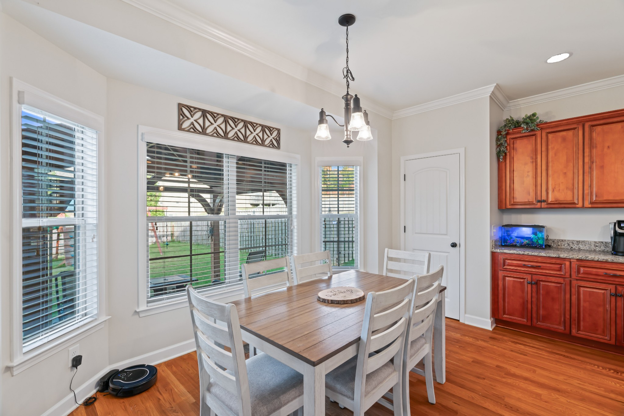 1003 Claymill Drive Spring Hill, TN 37174 - Photo 28 of 62 a view of a dining room with furniture wooden floor and chandelier
