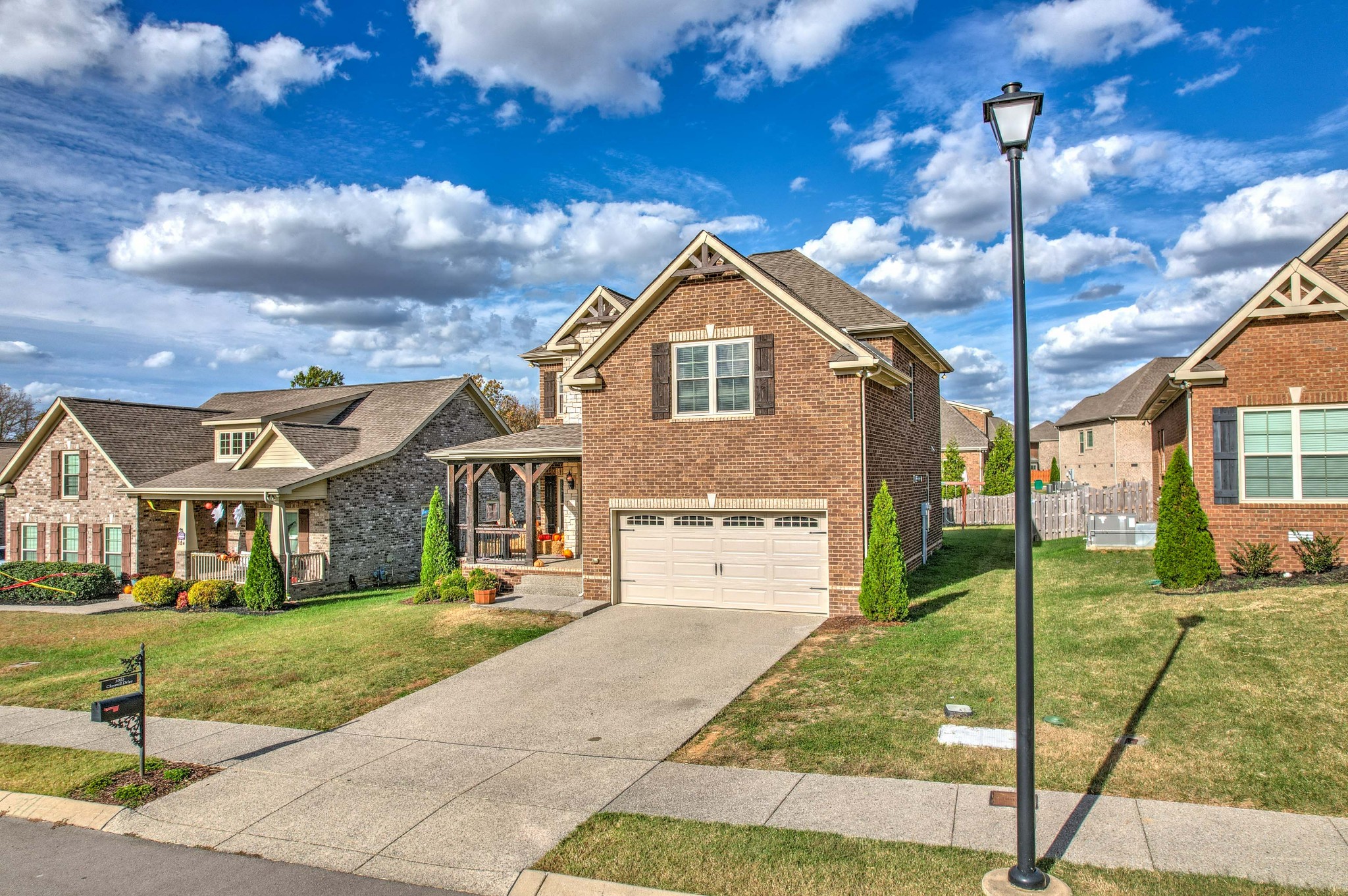 1003 Claymill Drive Spring Hill, TN 37174 - Photo 3 of 62 a front view of a house with a yard