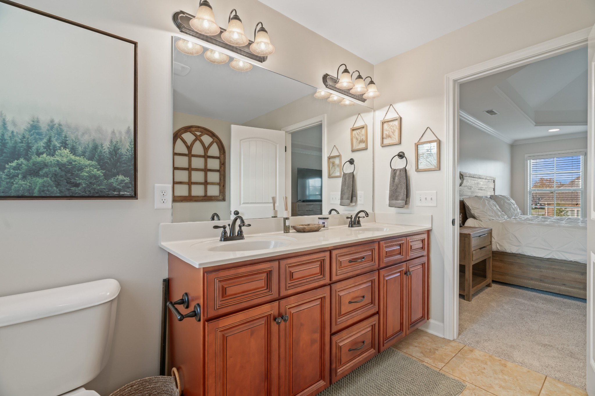1003 Claymill Drive Spring Hill, TN 37174 - Photo 37 of 62 a spacious bathroom with a double vanity sink a mirror a toilet and a shower