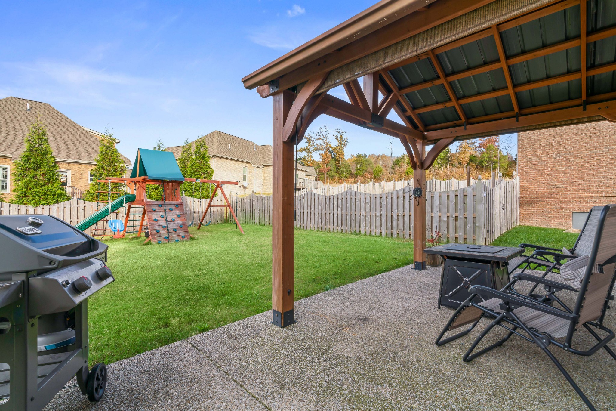 1003 Claymill Drive Spring Hill, TN 37174 - Photo 47 of 62 a view of a chair and table in backyard of the house