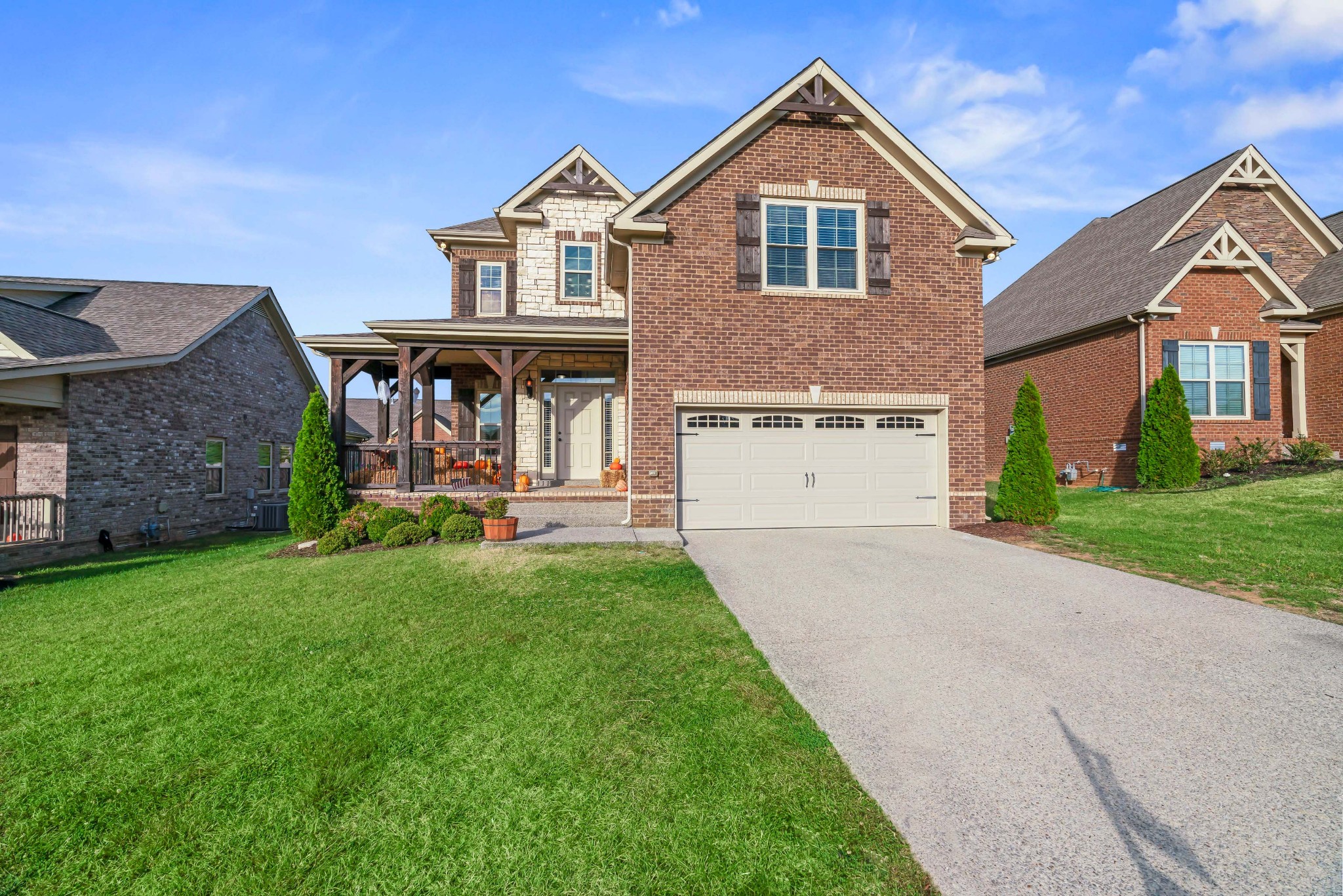 1003 Claymill Drive Spring Hill, TN 37174 - Photo 54 of 62 a front view of a house with a yard and garage