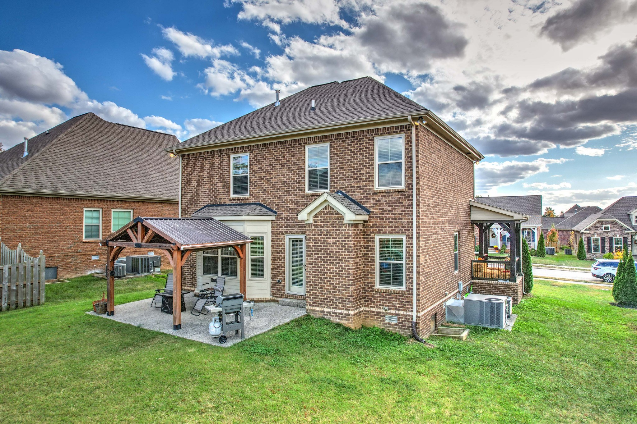 1003 Claymill Drive Spring Hill, TN 37174 - Photo 7 of 62 a front view of a house with a yard table and chairs