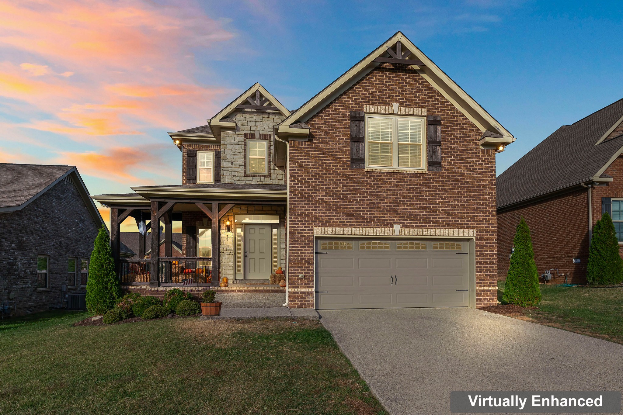 1003 Claymill Drive Spring Hill, TN 37174 - Photo 10 of 62 a front view of a house with a yard and garage