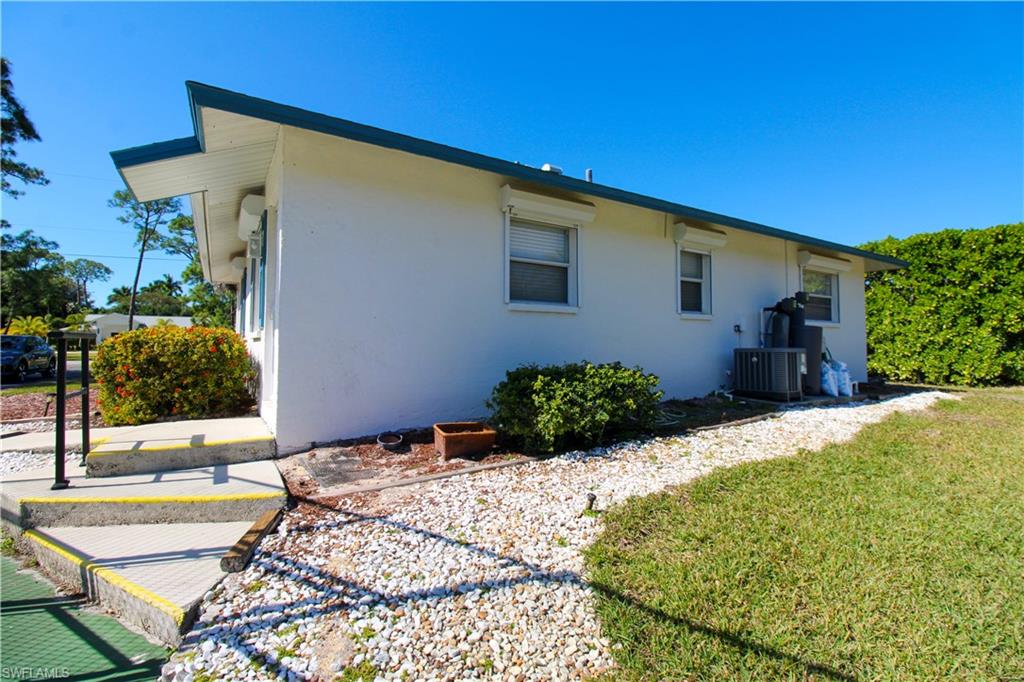 516 Gordonia Road Naples, FL 34108 - Photo 11 of 50 a view of a backyard of the house