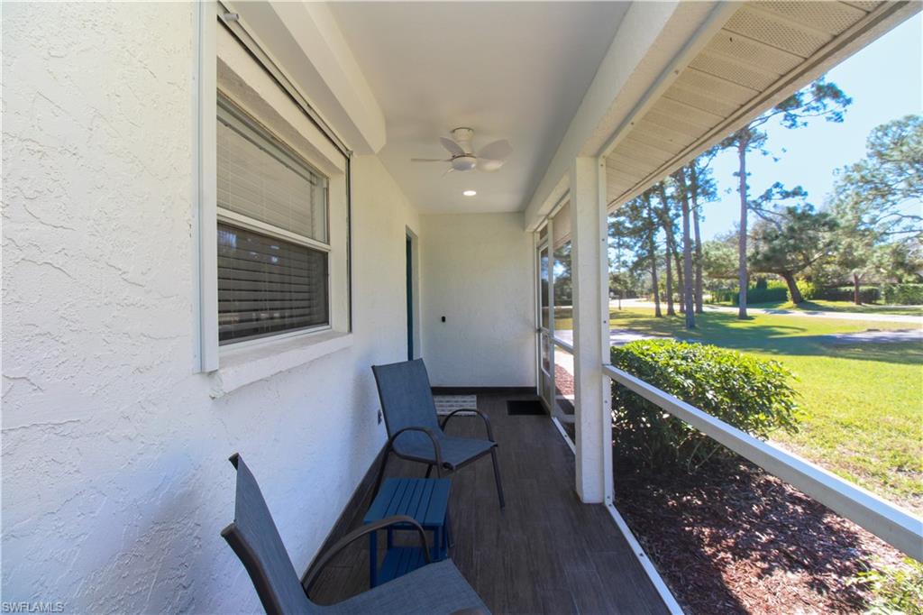516 Gordonia Road Naples, FL 34108 - Photo 15 of 50 a view of a porch with furniture and garden