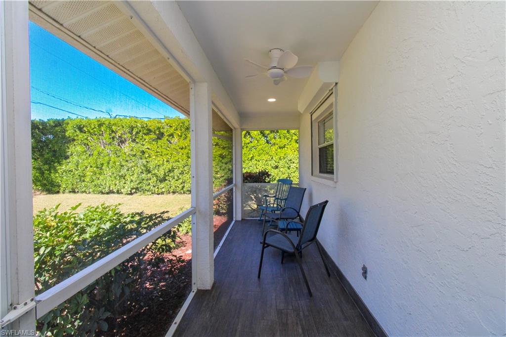 516 Gordonia Road Naples, FL 34108 - Photo 16 of 50 a view of a large window with wooden floor