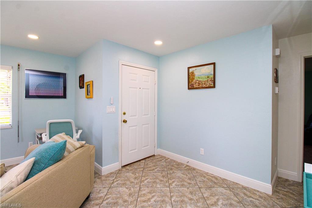 516 Gordonia Road Naples, FL 34108 - Photo 18 of 50 a living room with furniture and a window