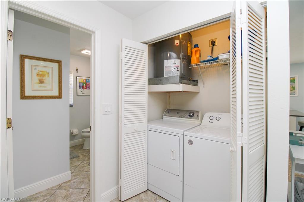 516 Gordonia Road Naples, FL 34108 - Photo 19 of 50 a utility room with dryer and washer