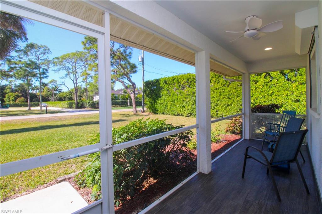 516 Gordonia Road Naples, FL 34108 - Photo 2 of 50 a view of a room with wooden floor and outdoor seating