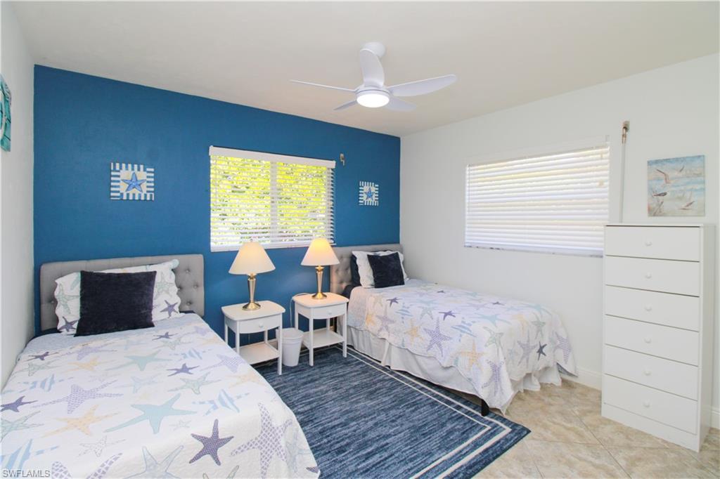 516 Gordonia Road Naples, FL 34108 - Photo 27 of 50 a bedroom with a bed and a window
