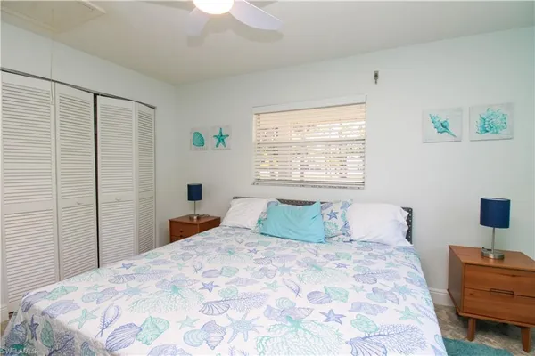 a bedroom with a large bed and a window
