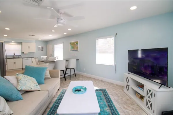 a living room with furniture and a flat screen tv
