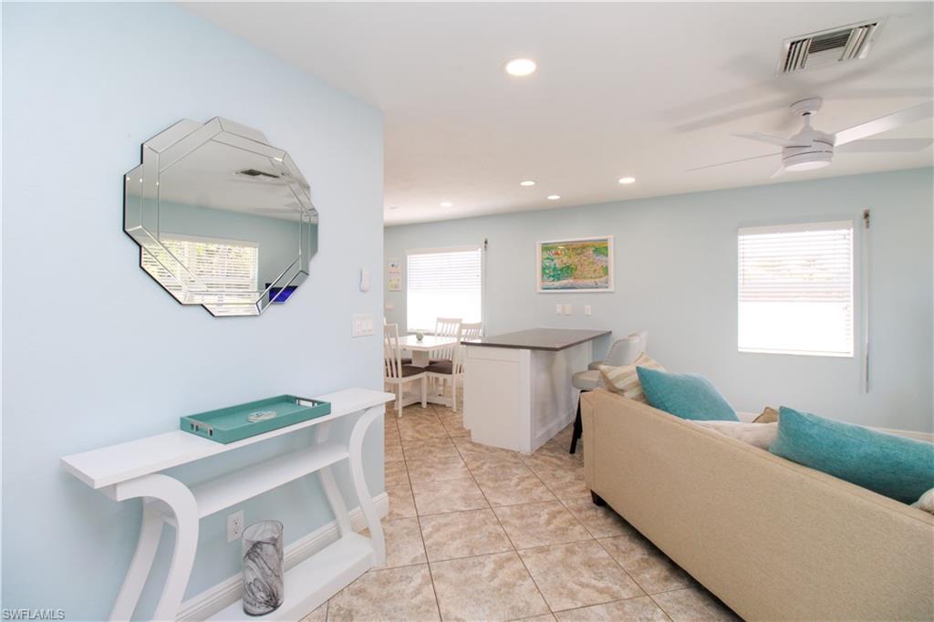 516 Gordonia Road Naples, FL 34108 - Photo 32 of 50 a living room with furniture and a window
