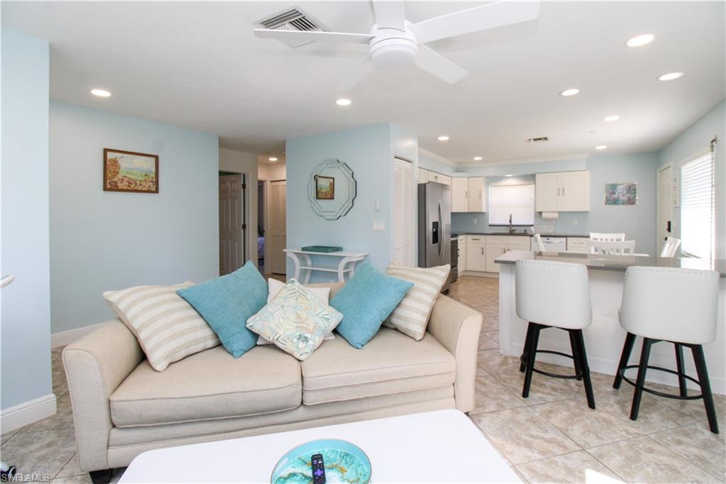 516 Gordonia Road Naples, FL 34108 - Photo 34 of 50 a living room with furniture and kitchen view