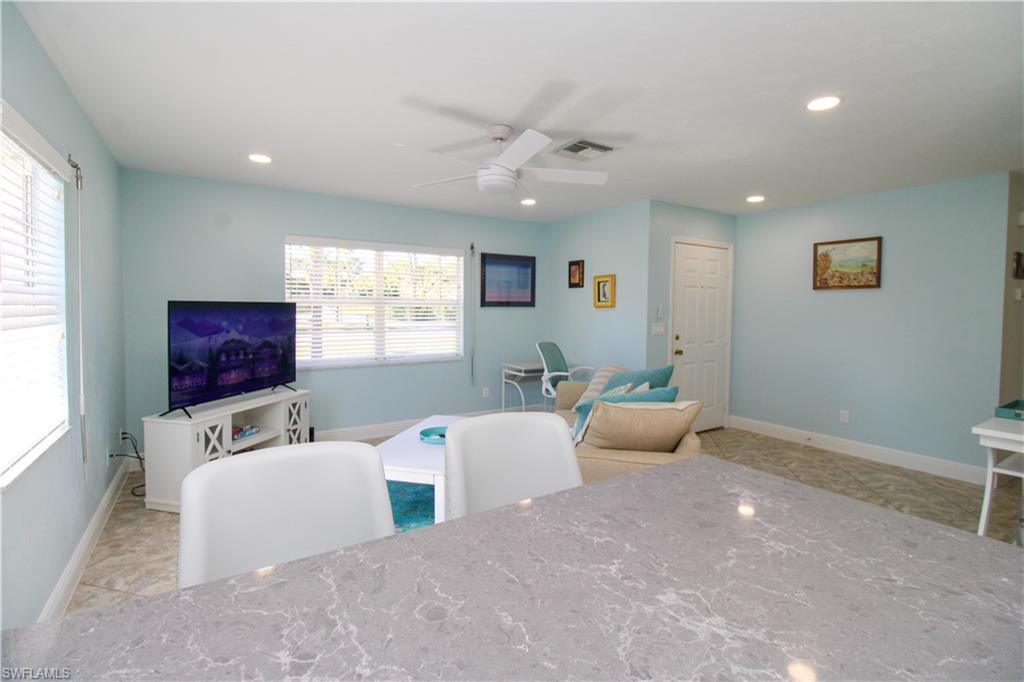 516 Gordonia Road Naples, FL 34108 - Photo 38 of 50 a living room with furniture and a window