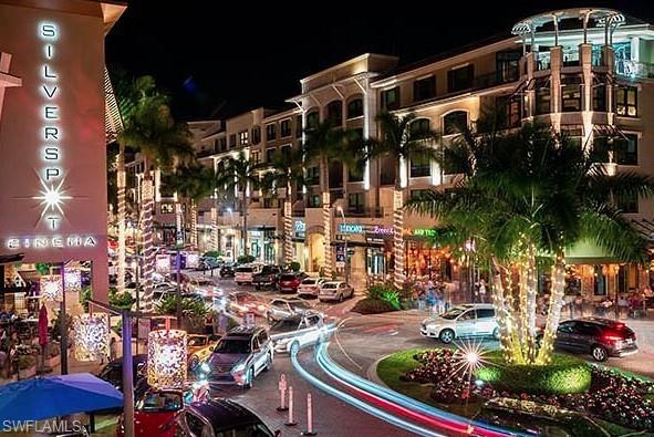 516 Gordonia Road Naples, FL 34108 - Photo 49 of 50 a city street filled with lots of traffic and tall buildings